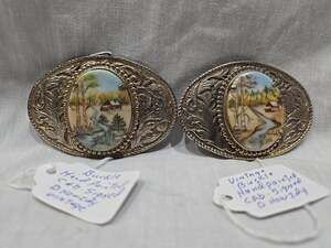 2 Vintage Belt Buckles Signed D HOWZDY Hand Painted House On Creek River G6
